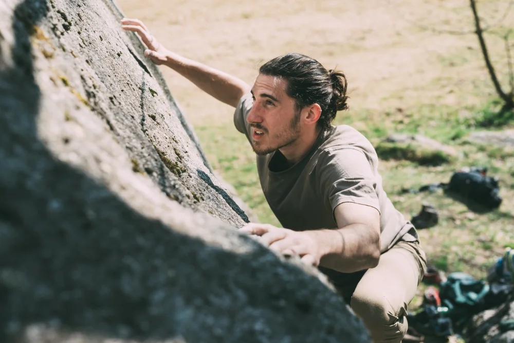 man bouldering on flat rock