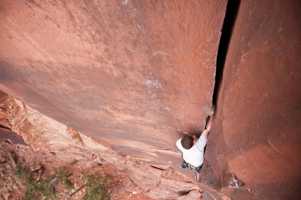 man crack climbing